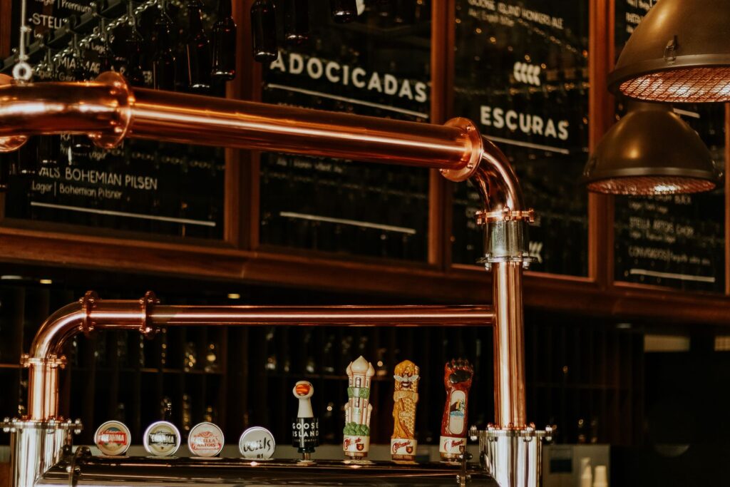 Brewery taproom interior with copper tanks, a setting for brewery event ideas