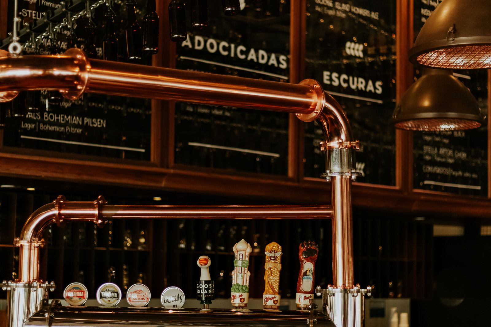 Brewery taproom interior with copper tanks, a setting for brewery event ideas