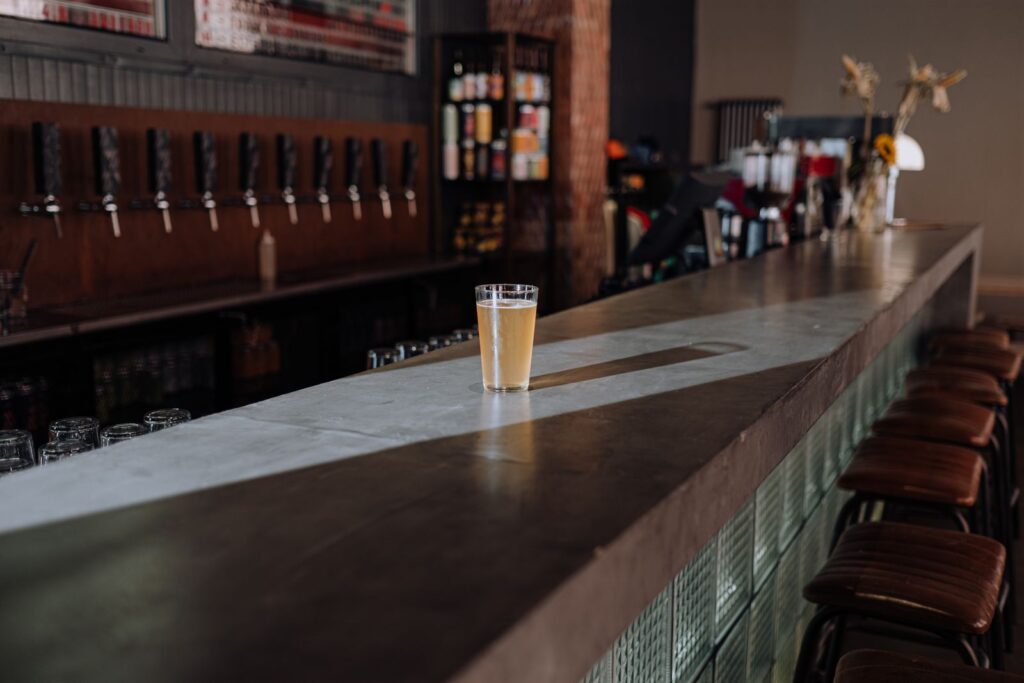 Glass of craft beer on a bar counter