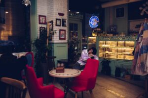 Warm cafe interior with guests relaxing