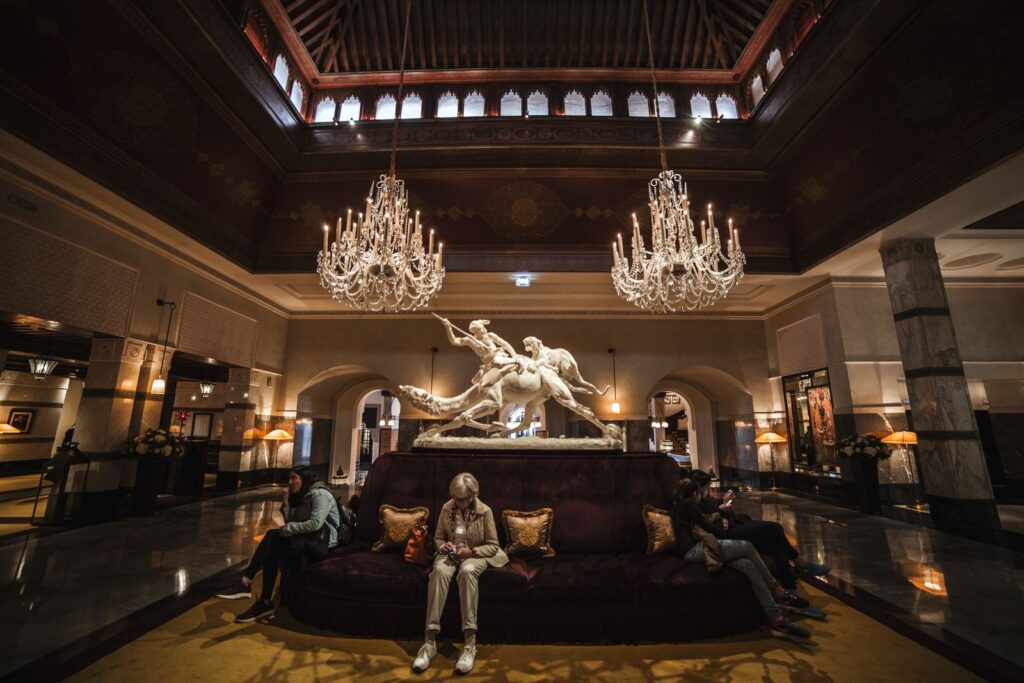 Guests relaxing in a spacious lobby, a space for Florida hotel amenities guests remember