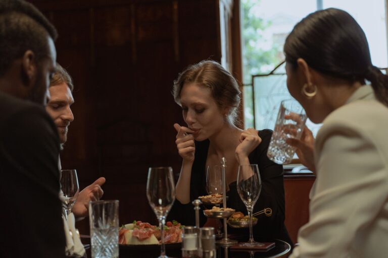 Friends enjoying dinner and drinks at a restaurant