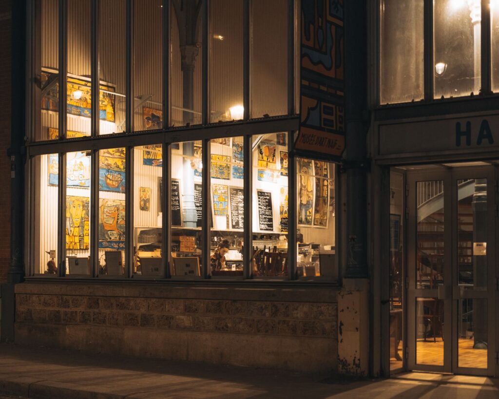 Warm glow from a cafe window in the evening