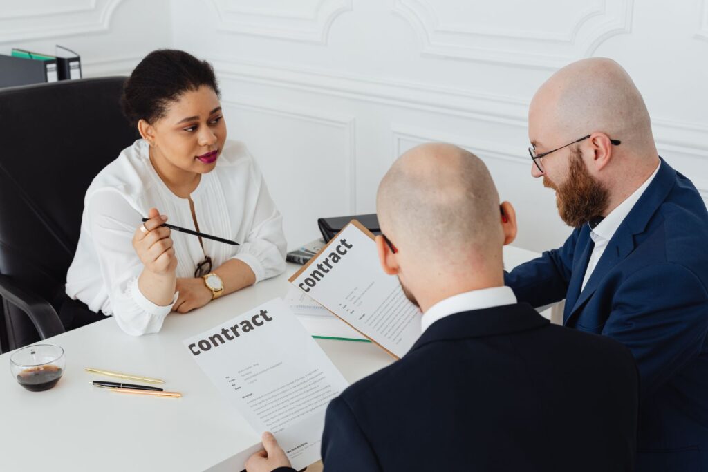 Business partners reviewing an agreement together at a table