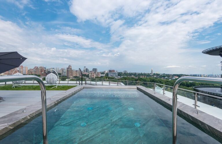 Rooftop pool at an apartment community with city views
