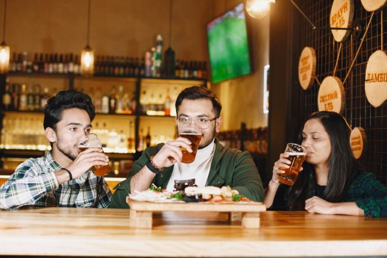 Friends sharing craft beers at a brewery taproom