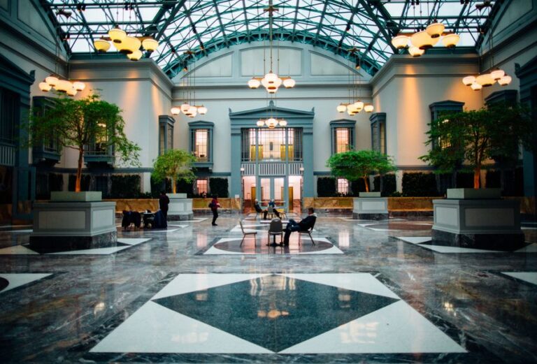 Bright modern hotel lobby with seating and plants