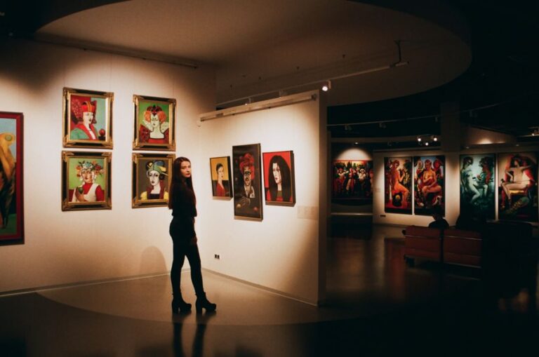 Visitor admiring paintings in a museum gallery